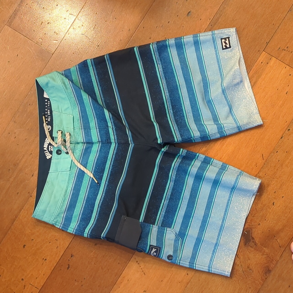 pair of Billabong board shorts, size 24.